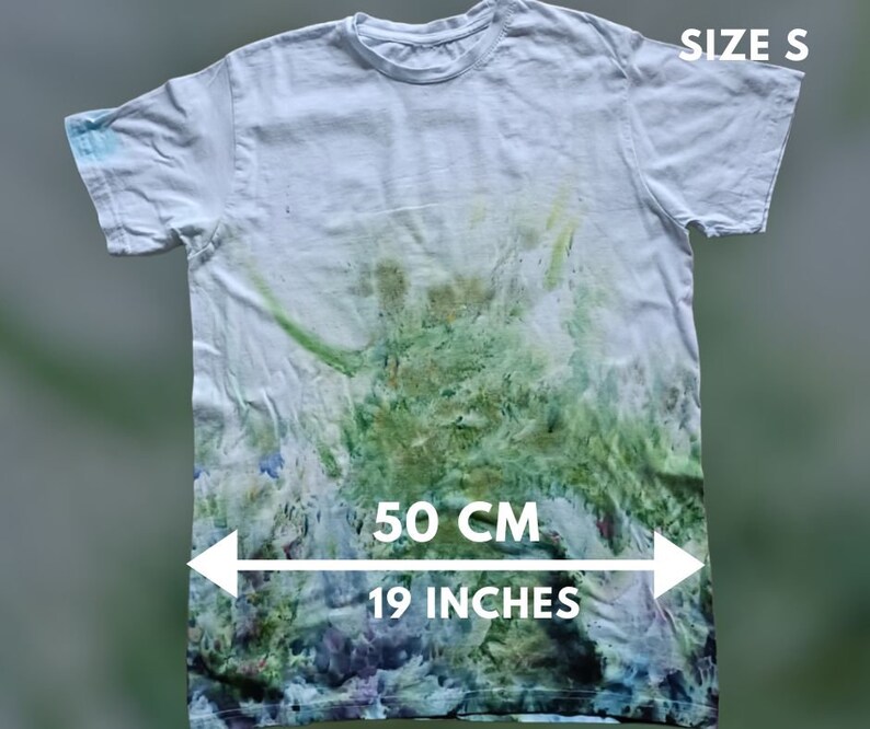 May include: White tie-dye t-shirt with green and blue accents. The shirt is size S and measures 19 inches across the chest.