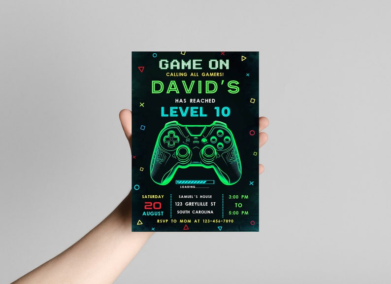 May include: A black and green video game party invitation with a neon green and blue gamepad graphic. The invitation reads "Game On Calling All Gamers! David's Has Reached Level 10". The invitation includes the date, time, and location of the party.