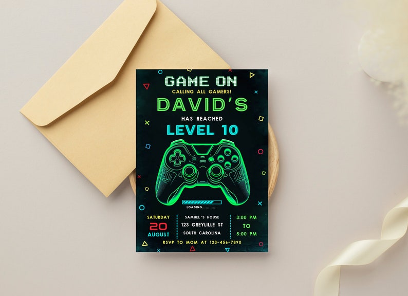 May include: A black and green birthday invitation with a neon green video game controller graphic. The text reads "Game On Calling All Gamers! David's Has Reached Level 10". The invitation includes details for a party on August 20th from 3:00 PM to 5:00 PM.