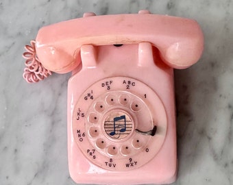 Boîte à musique téléphonique rotative rose vintage