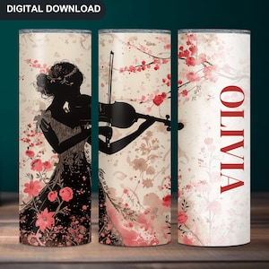 May include: A personalized stainless steel tumbler with a silhouette of a woman playing a violin. The background features a watercolor design of pink flowers and branches. The name "OLIVIA" is printed in red on the right side of the tumbler.