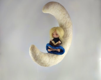 Woolen doll reading on the moon. Waldorf inspired needle felted mobile. Nursery decoration