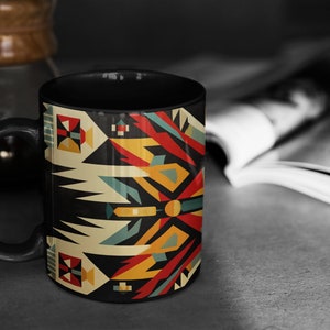 May include: Black coffee mug with a geometric pattern in shades of red, yellow, blue, and white. The pattern is reminiscent of Native American art.