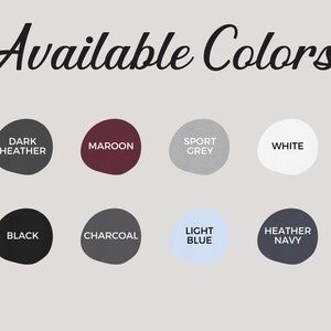 May include: A chart showing available colors for a product. The colors are: Dark Heather, Maroon, Sport Grey, White, Black, Charcoal, Light Blue, and Heather Navy.
