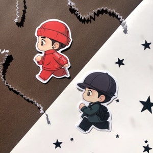 May include: Two cartoon character stickers, one in red and white running and the other in green and black running.