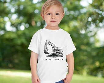 May include: White t-shirt featuring a black and white illustration of an excavator and the text "I Dig Jesus".