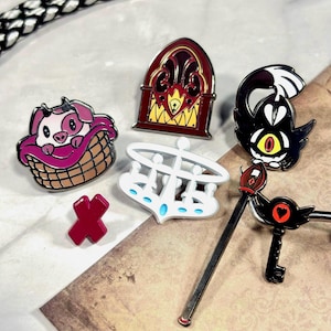 Filler Hard Enamel Pins | Hazbin Hotel Fanart | Alastor’s Radio and Cane, Sera’s Halo, Vaggie’s X, Fat Nuggets, and Keekee