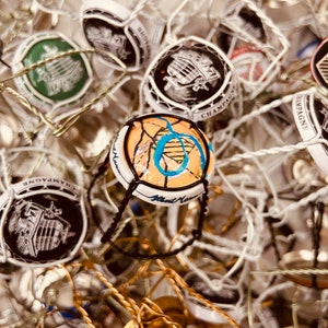 50 Used Champagne and Sparkling wine wire cages with capsules