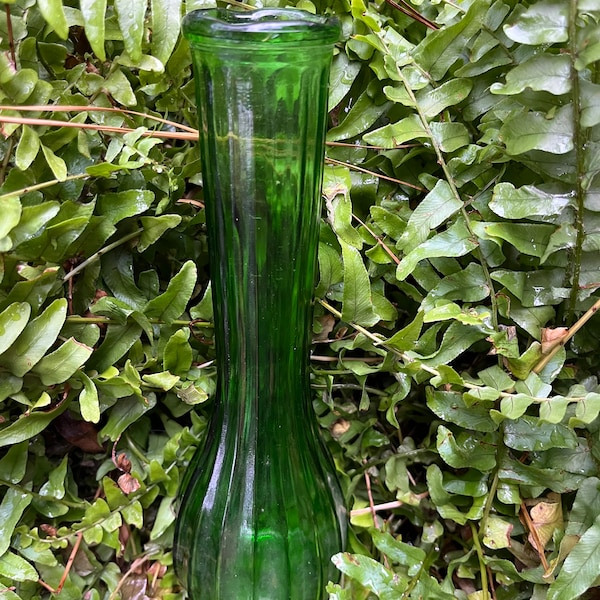 A vintage emerald green bottle/bud vase