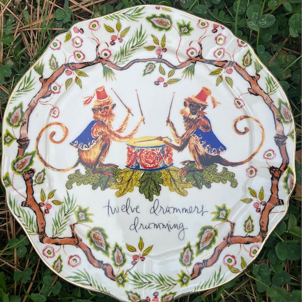 Anthropologie 2020 Christmas Edition salad plate. 12 Drummers Drumming . With Monkeys playing drums! Good condition.