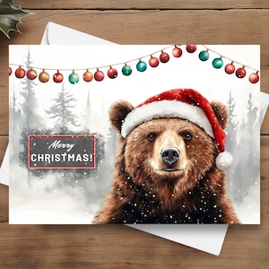Bär Weihnachtskarte, frohe Weihnachten Grizzly trägt eine Weihnachtsmütze in einer verschneiten winterlichen Szene, Braunbär Weihnachtsgeschenk, Aquarell Illustration