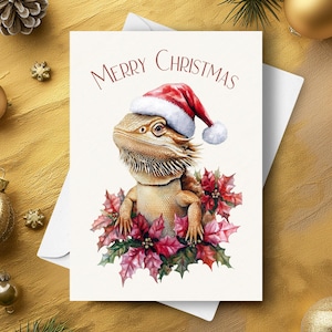Bearded Dragon Weihnachtskarte, Trägt einen Santa Hut und rote Weihnachtsstern-Girlande, niedliches Haustier Eidechsen-Feiertagsgeschenk, Aquarell Kunst Illustration