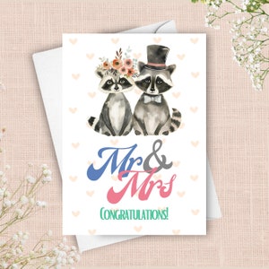 Carte de mariage de jeunes mariés raton laveur, carte de félicitations pour le mariage de M. et Mme, animal sauvage dans un noeud papillon et haut-de-forme, mariée avec couronne de fleurs