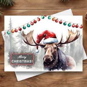 Cartão de Natal de alce, chapéu de Papai Noel de Natal, presente de alce de feliz Natal, animal da floresta em uma cena de inverno com neve, ilustração de arte em aquarela