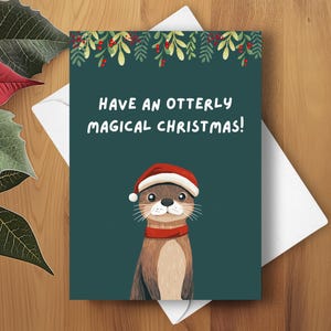 Tarjeta navideña con divertidos juegos de palabras de nutria, que tengas una Navidad mágica con nutrias, adorable saludo navideño con divertidos juegos de palabras de nutria, regalo de broma cómica