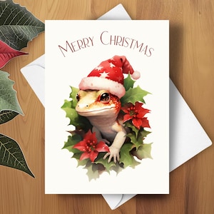 Cartão de Natal de lagarto, Cartão de Natal de lagartixa leopardo, Coroa de poinsétia vermelha, Chapéu de Papai Noel vermelho de Natal, Ilustração de arte em aquarela, Presente de lagarto