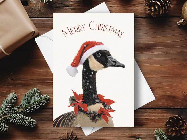 May include: A Christmas card featuring a goose wearing a red Santa hat and a red poinsettia garland. The card reads "Merry Christmas".