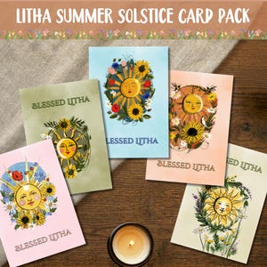 May include: A collection of five greeting cards with sun illustrations and the text "Blessed Litha". The cards feature a smiling sun surrounded by flowers and foliage. The cards are on a wooden surface with lit candles.