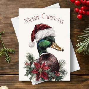 Eend kerstkaart, draagt een kerstmuts en rode kerstster slinger, wilde eend wildlife vogel vakantie cadeau, aquarel kunst illustratie