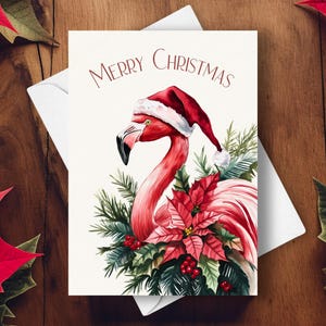 Flamingo Weihnachtskarte, Trägt einen Nikolaushut und eine rote Weihnachtsstern-Girlande, rosa tropisches Wildtier-Feiertagsgeschenk, Aquarell Kunst Illustration