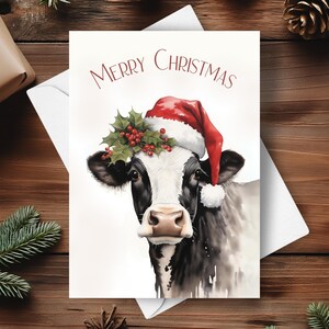 Cartão de Natal de vaca, Cartão de Natal de vaca leiteira, Coroa de poinsétia vermelha, Chapéu de Papai Noel vermelho de Natal, Ilustração de arte em aquarela, Presente de Natal na fazenda