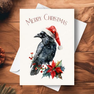 Cartão de Natal Raven, usando um chapéu de Papai Noel e guirlanda de poinsétia vermelha, presente de Natal Black Bird Raven Wildlife, ilustração de arte em aquarela