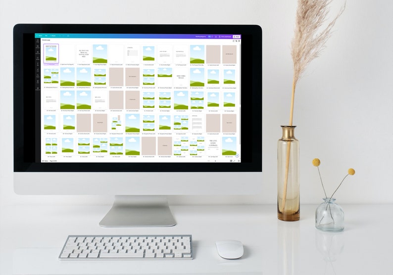 May include: A computer screen shows a design layout with multiple image placeholders and text boxes. The screen displays a variety of mockups with landscape images and text. A keyboard, mouse, and decorative vases are in the foreground.