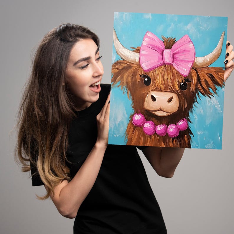 May include: A painting of a brown Highland cow with a pink bow and a pink beaded necklace on a blue background.