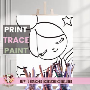 May include: A black and white line drawing of a girl with a star on a white canvas. The canvas is on an easel and there are paintbrushes in front of it. The text "PRINT TRACE PAINT" is on the canvas. The text "HOW TO TRANSFER INSTRUCTIONS INCLUDED" is below the canvas.