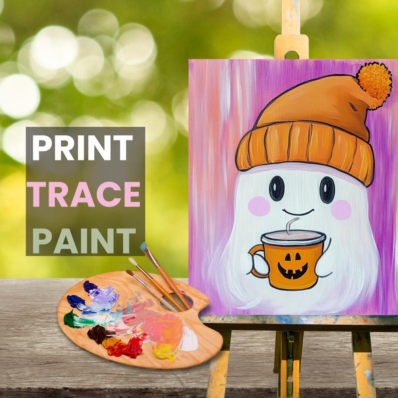 May include: A painting of a ghost wearing an orange knit hat and holding a pumpkin-shaped mug. The ghost has a pink blush on its cheeks and a happy expression. The background is a pink and white gradient. The painting is on a wooden easel. The image also includes a wooden paint palette with various colors of paint.