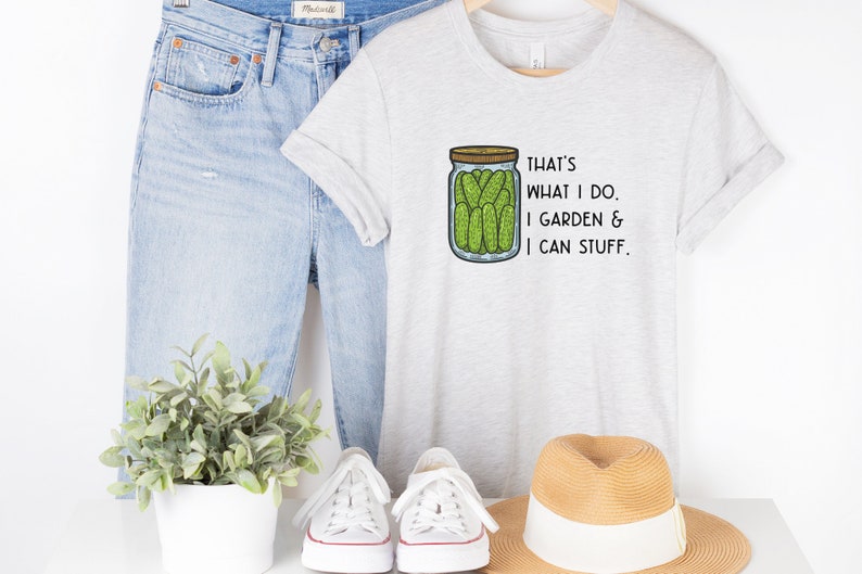 May include: A gray t-shirt with a graphic of a jar of pickles and the text "That's what I do. I garden & I can stuff."