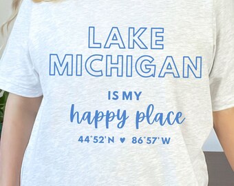 May include: A heather grey t-shirt with blue text that reads "Lake Michigan is my happy place 44'52' N ♥ 86'57' W"