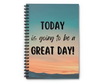 May include: A spiral bound notebook with a blue and orange sunset background. The text "TODAY is going to be a GREAT DAY!" is printed in black on the front cover.
