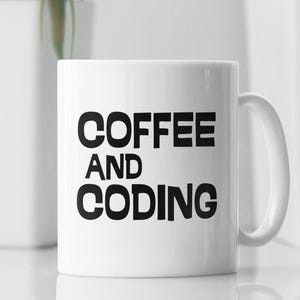 May include: White ceramic coffee mug with black text that reads "Coffee and Coding".