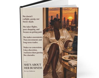 May include: A hardcover book titled She's About Her Business by Lee Claiborne. The cover features a person in a gold satin robe sitting in a chair before a city skyline at sunset, with text detailing business-focused lifestyle choices.
