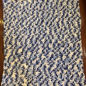 Blue and white fuzzy baby blanket