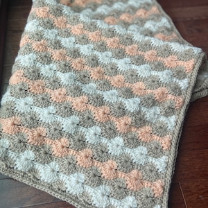 Peach, cream, and beige baby blanket