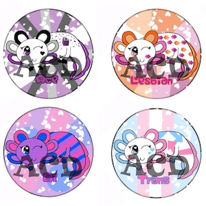 May include: Eight colorful axolotl buttons with different pride flags and labels. The axolotls are all sleeping with their eyes closed. The labels are: Demigirl, Ace, Lesbian,  Bi, Demiboy, Trans,  Non-Binary, and  Pride.
