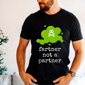 May include: A black t-shirt with a green cartoon cloud with a skull and crossbones and the text "fartner not a partner".