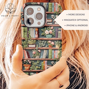 May include: A phone case with a green background and a bookshelf design. The bookshelf is filled with books and plants. The case has a camera cutout and a MagSafe compatible design.  MORE DESIGNS, MAGSAFE® OPTIONAL, IPHONE & ANDROID.