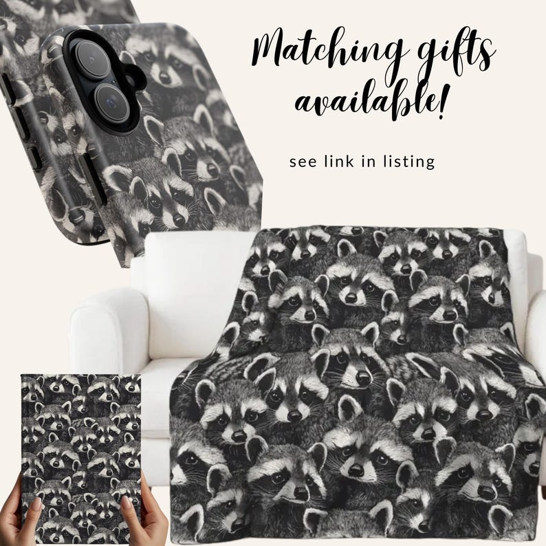 May include: A black and white raccoon-themed blanket, phone case, and journal. The blanket is draped over a white couch. The phone case is angled to show the design. The journal is held by a person. Text reads "Matching gifts available!" and "see link in listing."