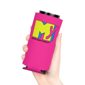May include: A pink can cooler featuring the MTV logo in yellow, blue, and pink, with the text "40TH BIRTHDAY". The cooler is held in a hand and is designed to keep beverages cold.