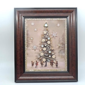 May include: Framed Christmas artwork featuring a decorated tree with sparkling embellishments and snowflakes. The artwork includes a brown frame with a decorative border. Children are depicted at the base of the tree, creating a festive winter scene.