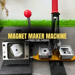 May include: A black magnet maker machine with a red handle and a gold metal base. The machine has a die for making octagonal magnets and two dies for making square magnets. The text "MAGNET MAKER MACHINE**FREE DELIVERY!**" is displayed on the machine.