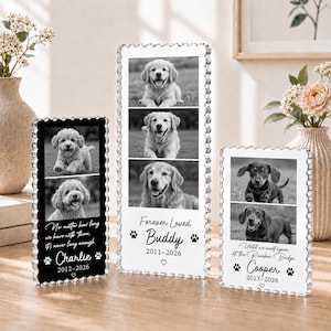 May include: Three rectangular acrylic memorial plaques with scalloped edges, each featuring black and white dog photographs, names, dates, and memorial text. The plaques display the names Charlie, Buddy, and Cooper with paw print accents.