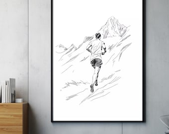 May include: Black and white framed print of a runner ascending a mountain. The artwork depicts a person in athletic wear, running uphill on a mountain trail. The background features a detailed mountain range, rendered in a minimalist style.