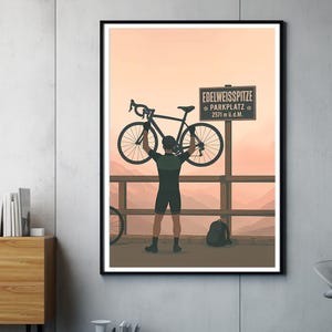 May include: A cyclist holds a black bicycle above their head at the Edelweiss Spitze Parkplatz, a mountain pass at 2571 meters above sea level. The cyclist is wearing a black jersey and black shorts. The background is a sunset sky with mountains in the distance.