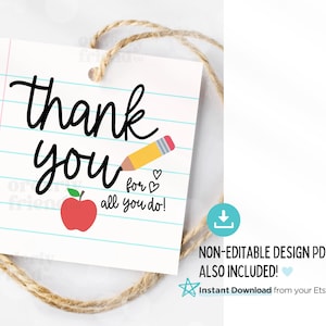 May include: A printable thank you tag with a red apple and a pencil on a blue and white lined background. The text reads "thank you for all you do!"
