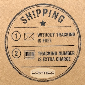 May include: A circular stamp on a cardboard surface with the word "SHIPPING" at the top. Below, it states "WITHOUT TRACKING IS FREE" and "TRACKING NUMBER IS EXTRA CHARGE". The brand name "Colemico" is at the bottom.