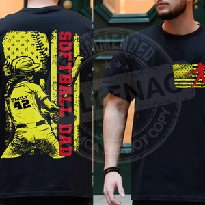 May include: Black t-shirt with a graphic of a softball player in a yellow uniform with the text "Softball Dad" and "Emily 42" on the shirt.